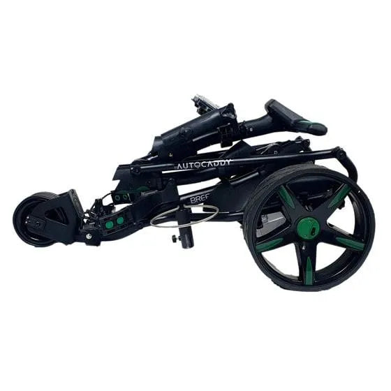 Folded Autocaddy lithium electric golf buggy with black and green wheels from Hillside Buggies