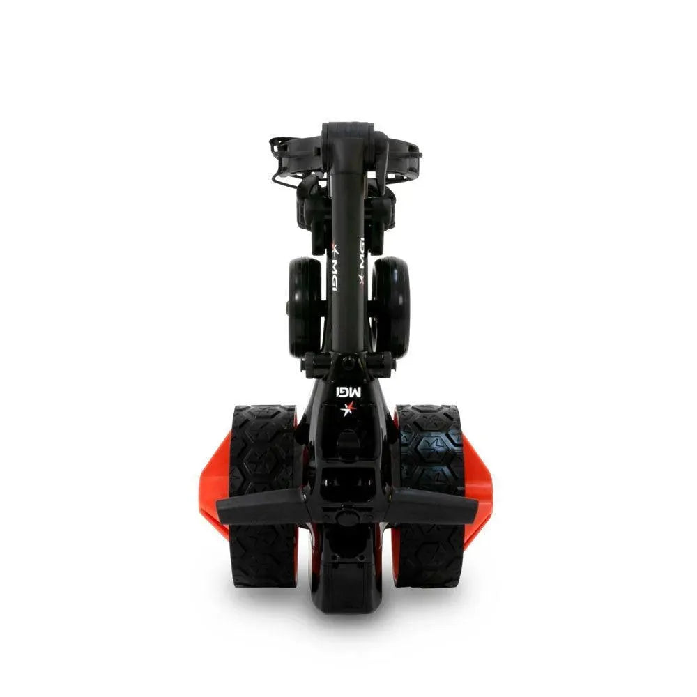 Folded MGI Zip X3 electric golf buggy with large treaded wheels, shown on white background