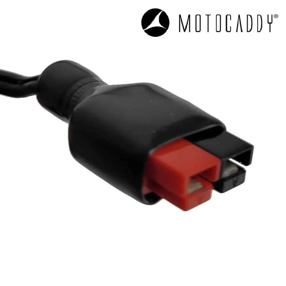 Close-up of Motocaddy lithium battery charger connector with red and black terminals